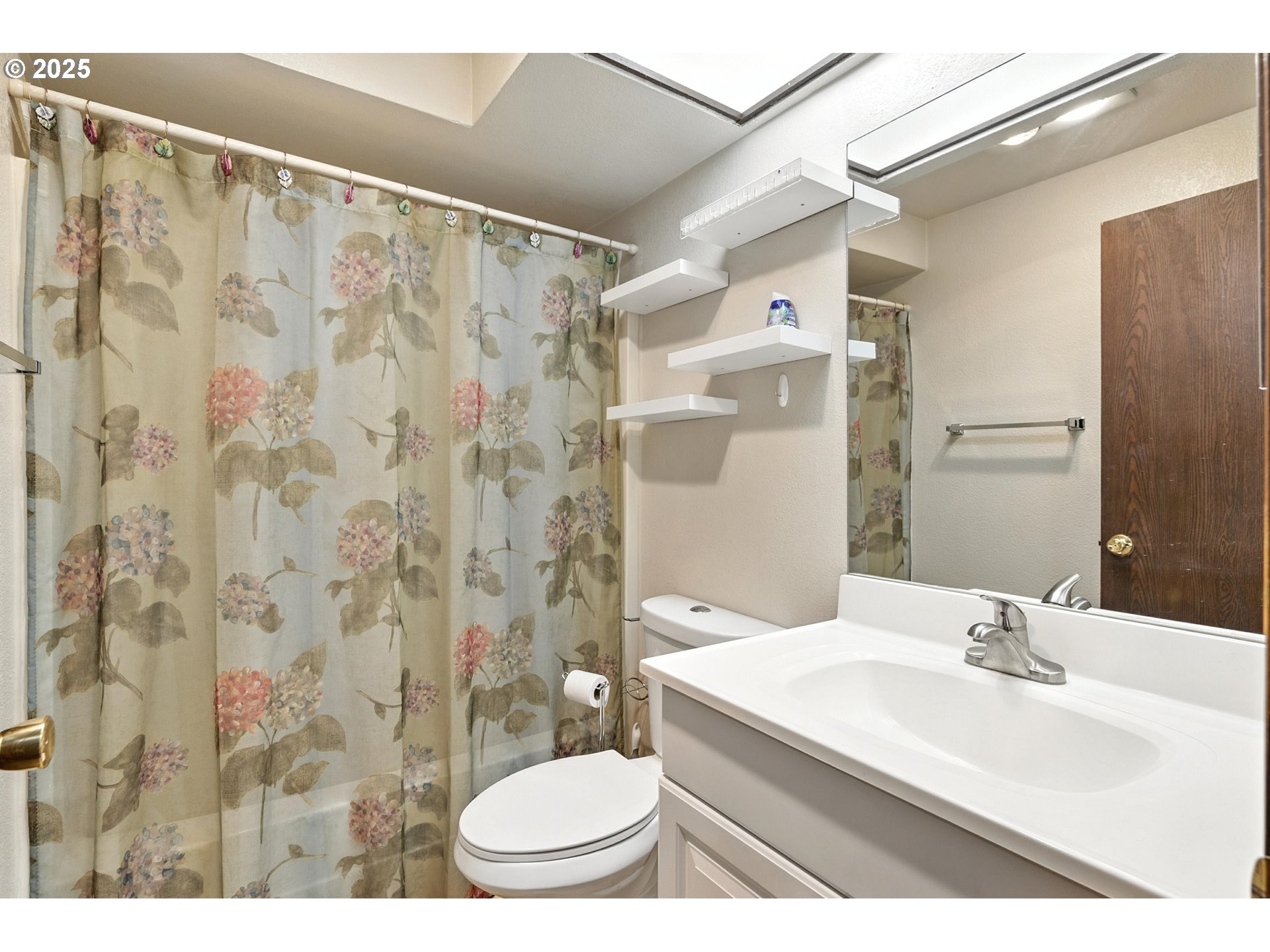 3404 19th Avenue, Unit 117 Forest Grove, OR 97116 - Photo 14 of 18 a bathroom with a sink toilet a mirror and shower