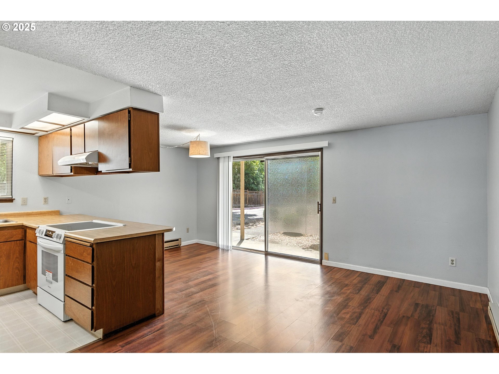 3404 19th Avenue, Unit 117 Forest Grove, OR 97116 - Photo 4 of 18 a view of cabinets with wooden floor and window