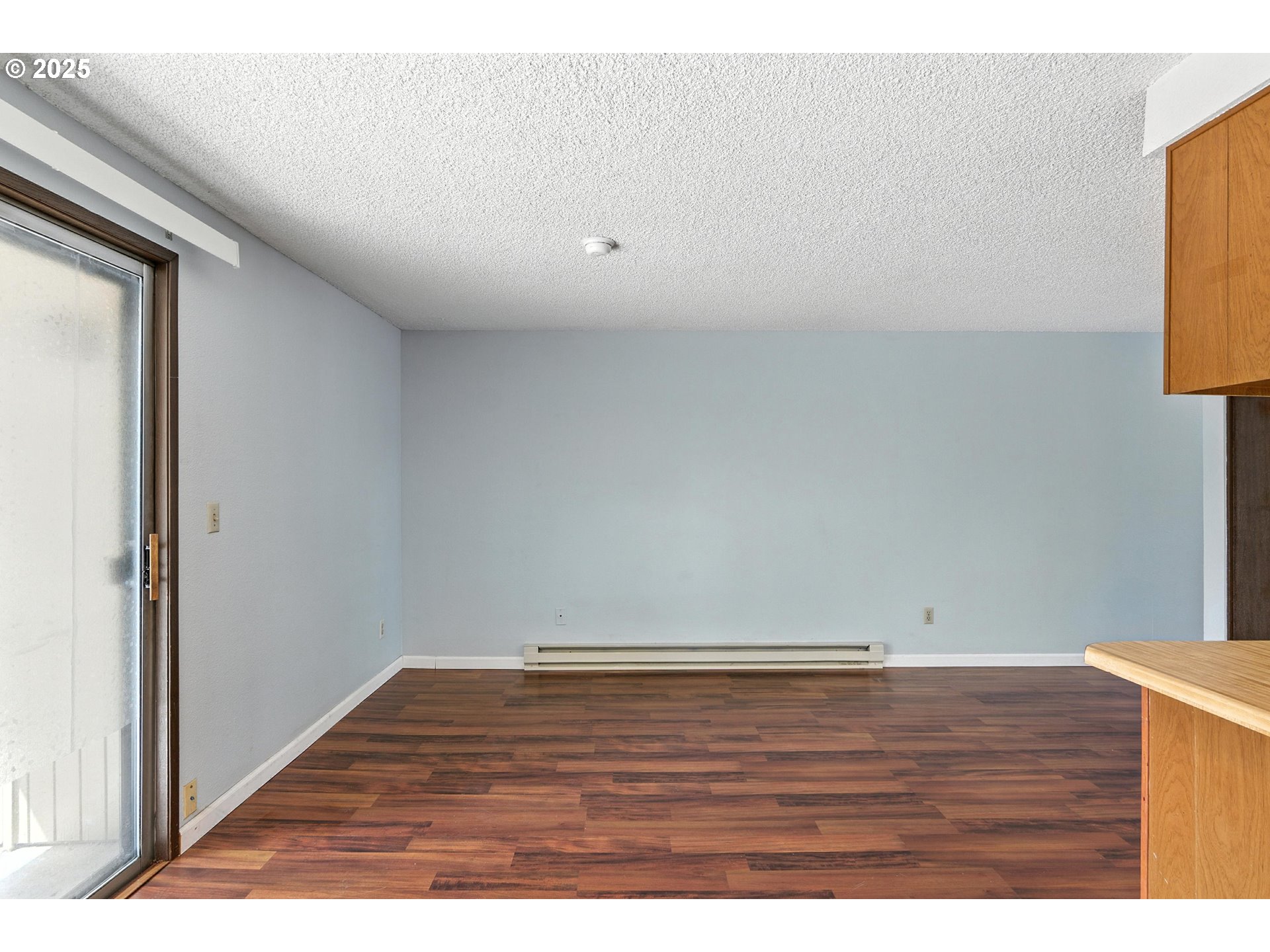 3404 19th Avenue, Unit 117 Forest Grove, OR 97116 - Photo 8 of 18 a view of room with wooden floor