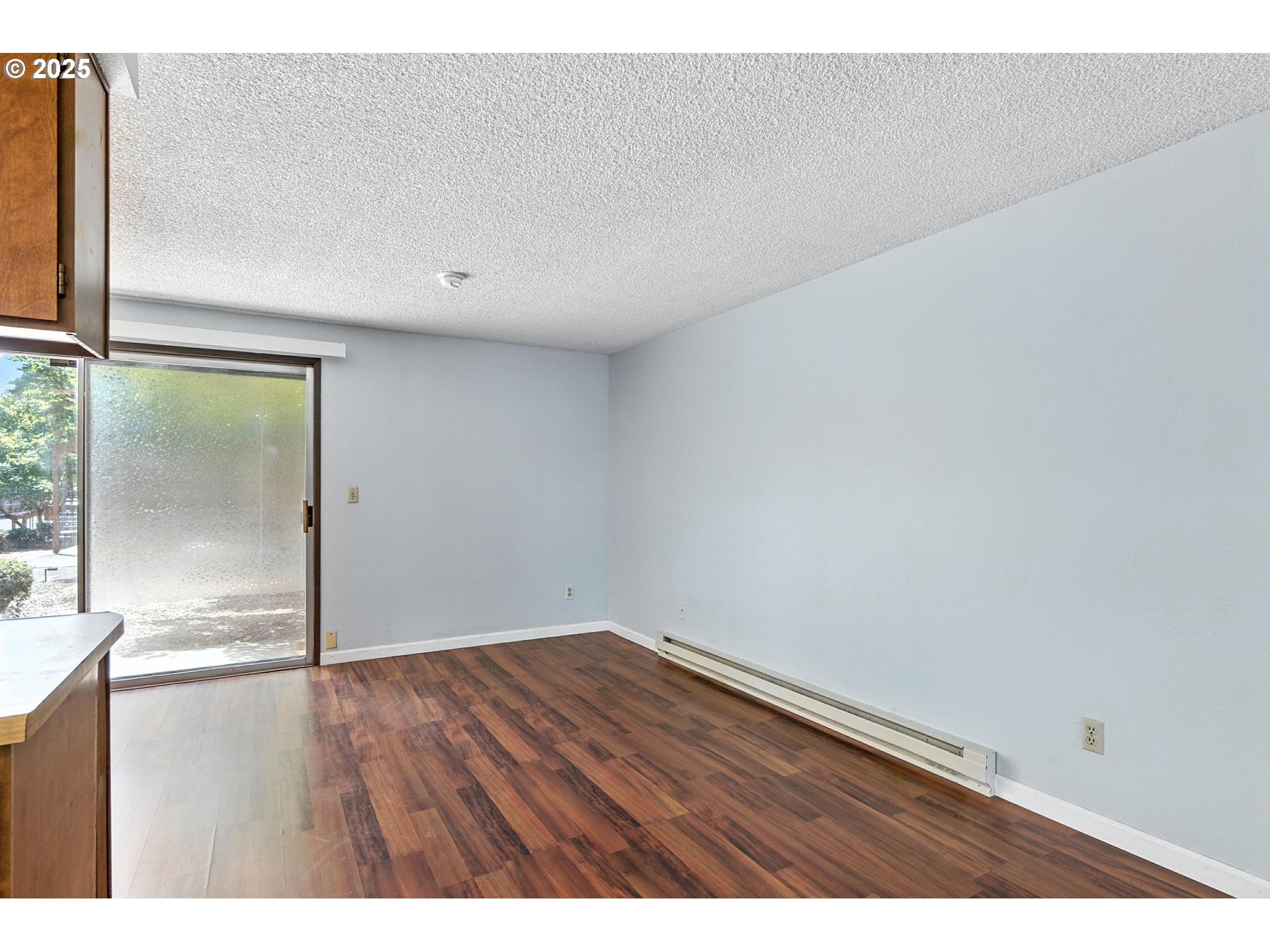 3404 19th Avenue, Unit 117 Forest Grove, OR 97116 - Photo 10 of 18 a view of empty room with wooden floor