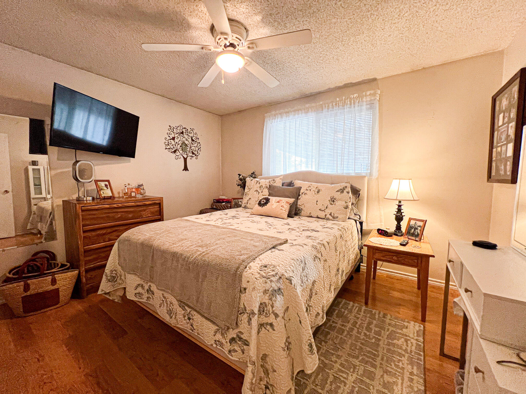 1225 East B Street Fossil, OR 97830 - Photo 18 of 33 a bedroom with a bed and a flat screen tv