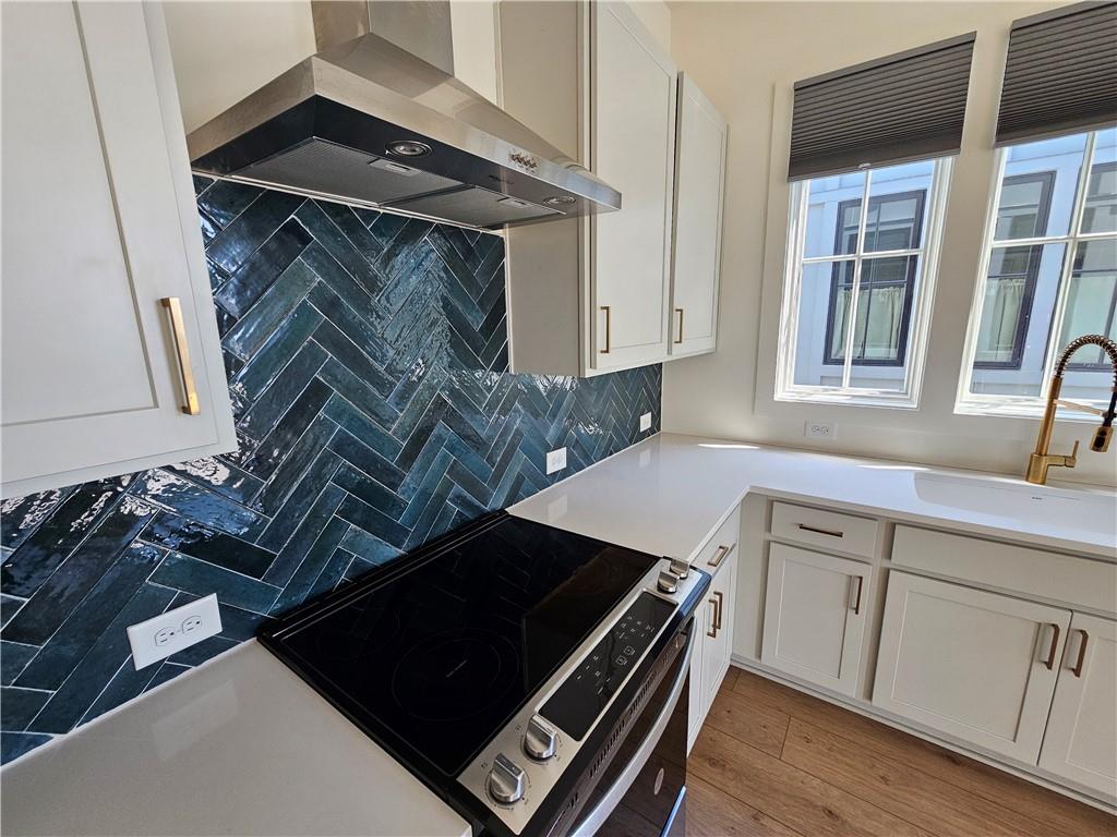 1294 Longreen Terrace Northwest, Unit 2 Atlanta, GA 30318 - Photo 15 of 25 a kitchen with a sink and cabinets