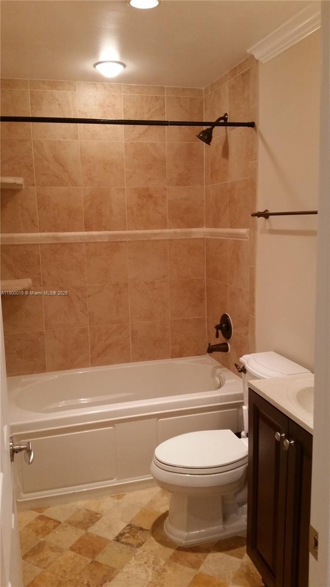 11071 Southwest 11th Place, Unit 124 Davie, FL 33324 - Photo 11 of 18 a bathroom with a toilet and a shower