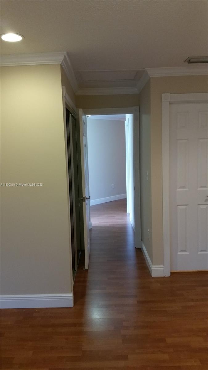 11071 Southwest 11th Place, Unit 124 Davie, FL 33324 - Photo 7 of 18 a view of a room with wooden floor