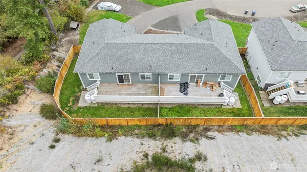 an aerial view of a house with a yard