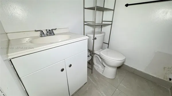 a view of a door and a sink