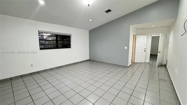 a kitchen with a sink and a stove top oven