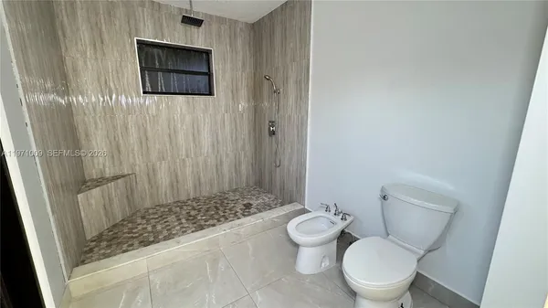 a kitchen with stainless steel appliances a refrigerator and a stove