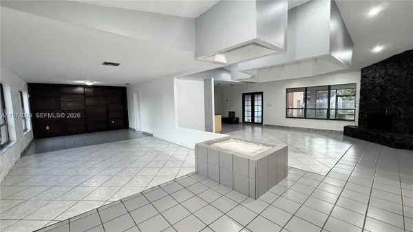a large white room with chandelier