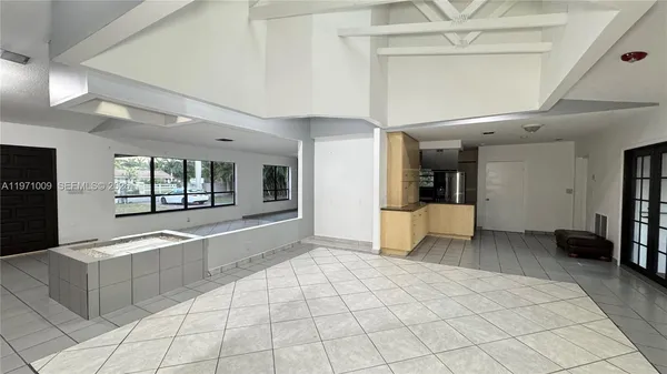 a view of a livingroom with furniture and windows