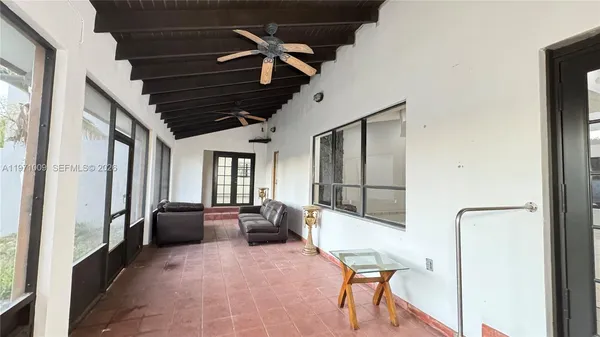 a kitchen with a refrigerator and a sink