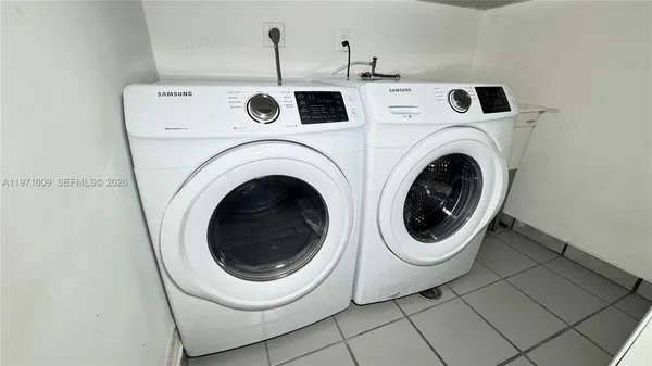 a view of a kitchen with wooden floor