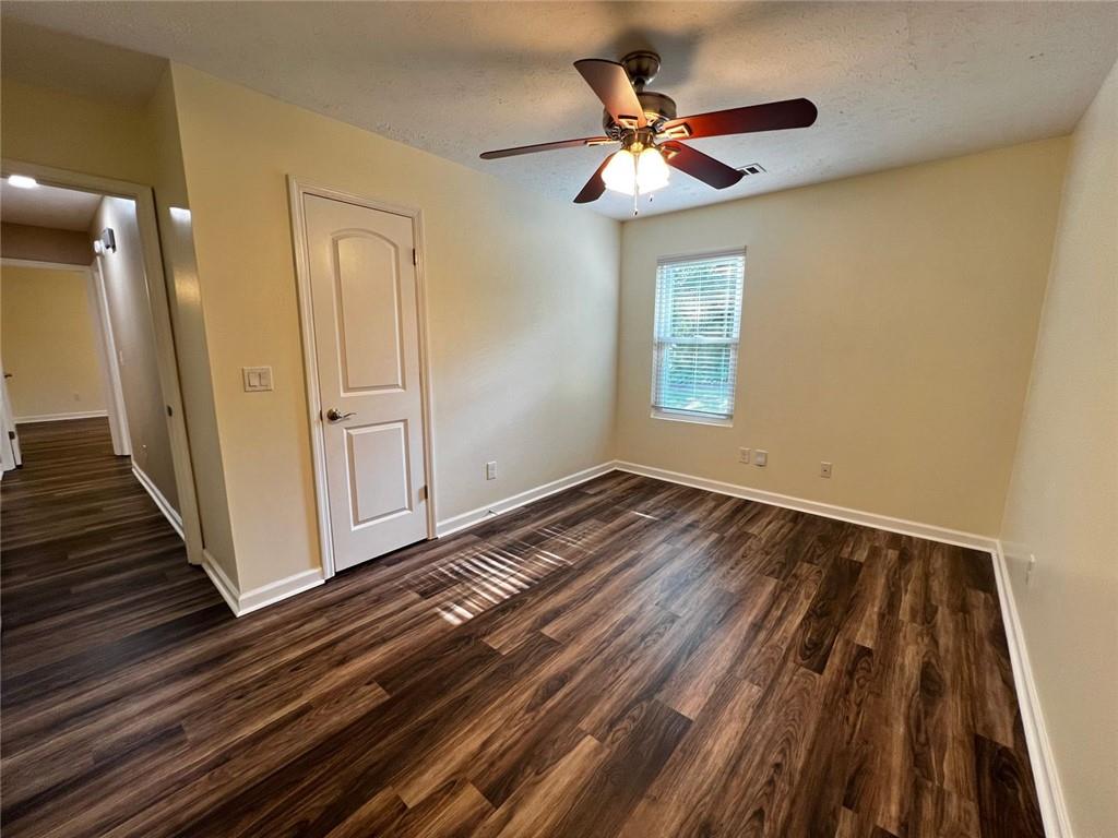 4170 Shiloh Ridge Trail Kennesaw, GA 30144 - Photo 12 of 19 wooden floor in an empty room with a window
