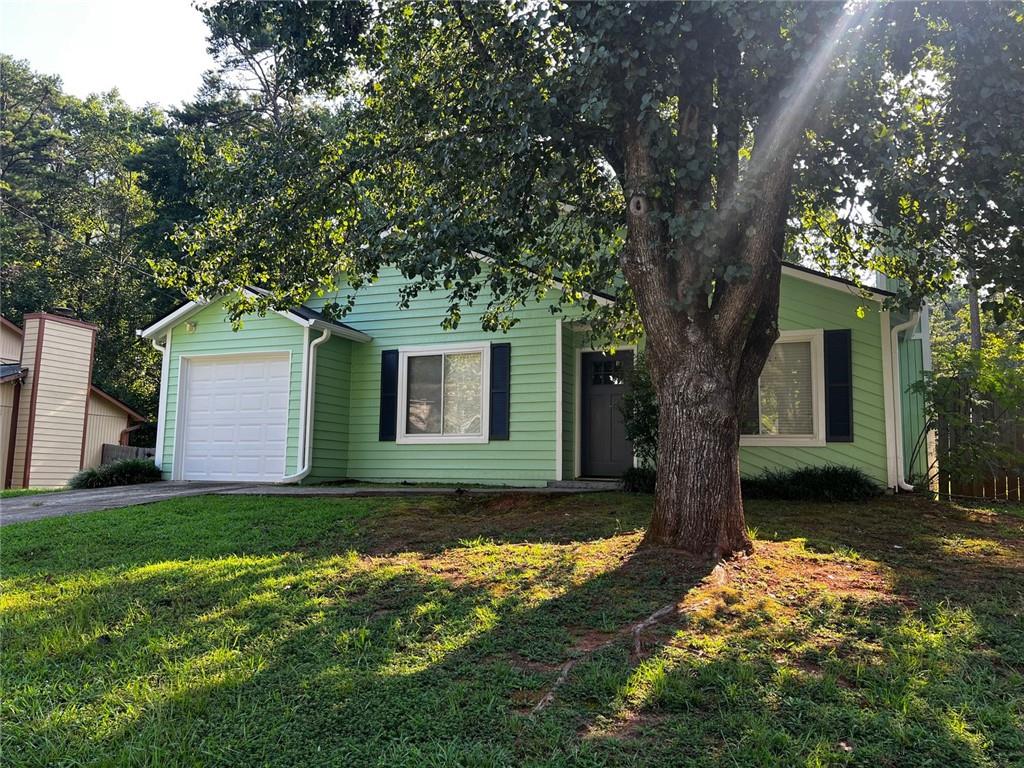 4170 Shiloh Ridge Trail Kennesaw, GA 30144 - Photo 2 of 19 a view of a backyard with a tree