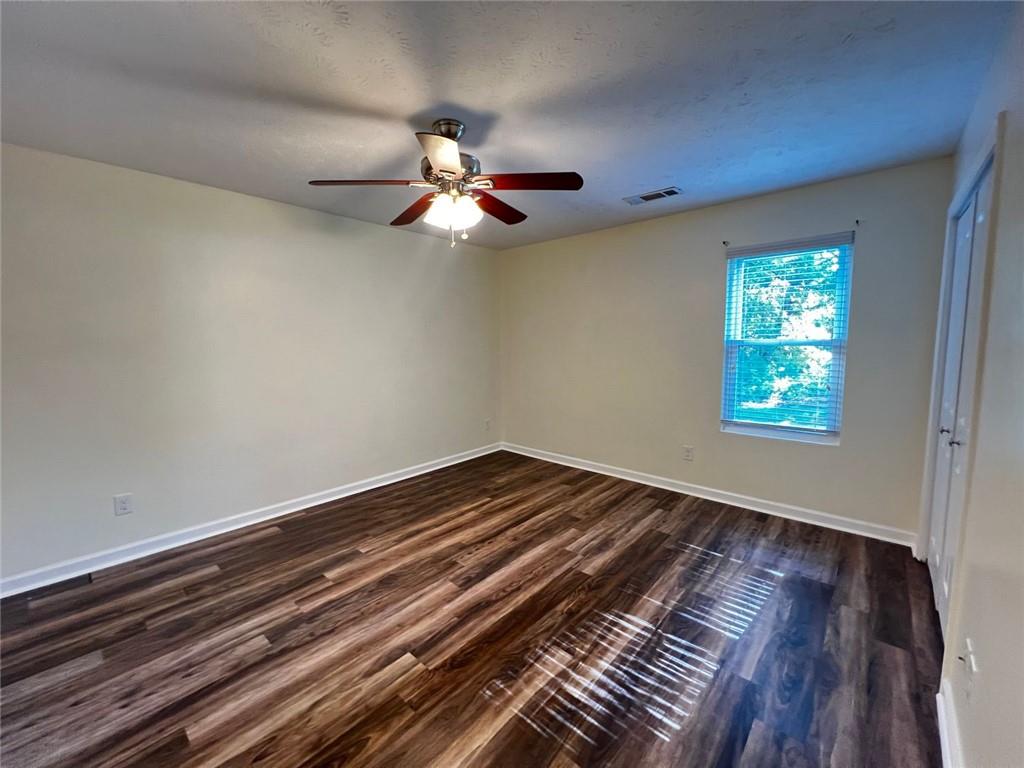 4170 Shiloh Ridge Trail Kennesaw, GA 30144 - Photo 9 of 19 a view of room with hardwood floor and ceiling fan