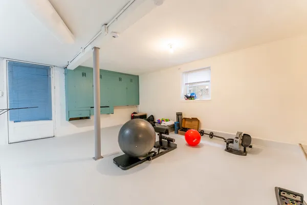 a view of a storage and utility room with a washer dryer