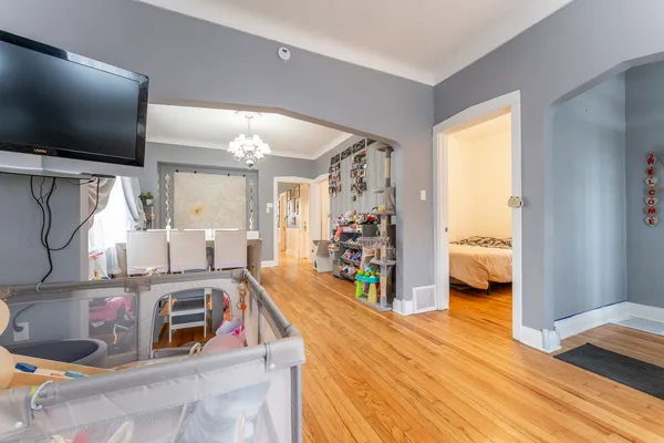 a kitchen that has a lot of cabinets and wooden floor