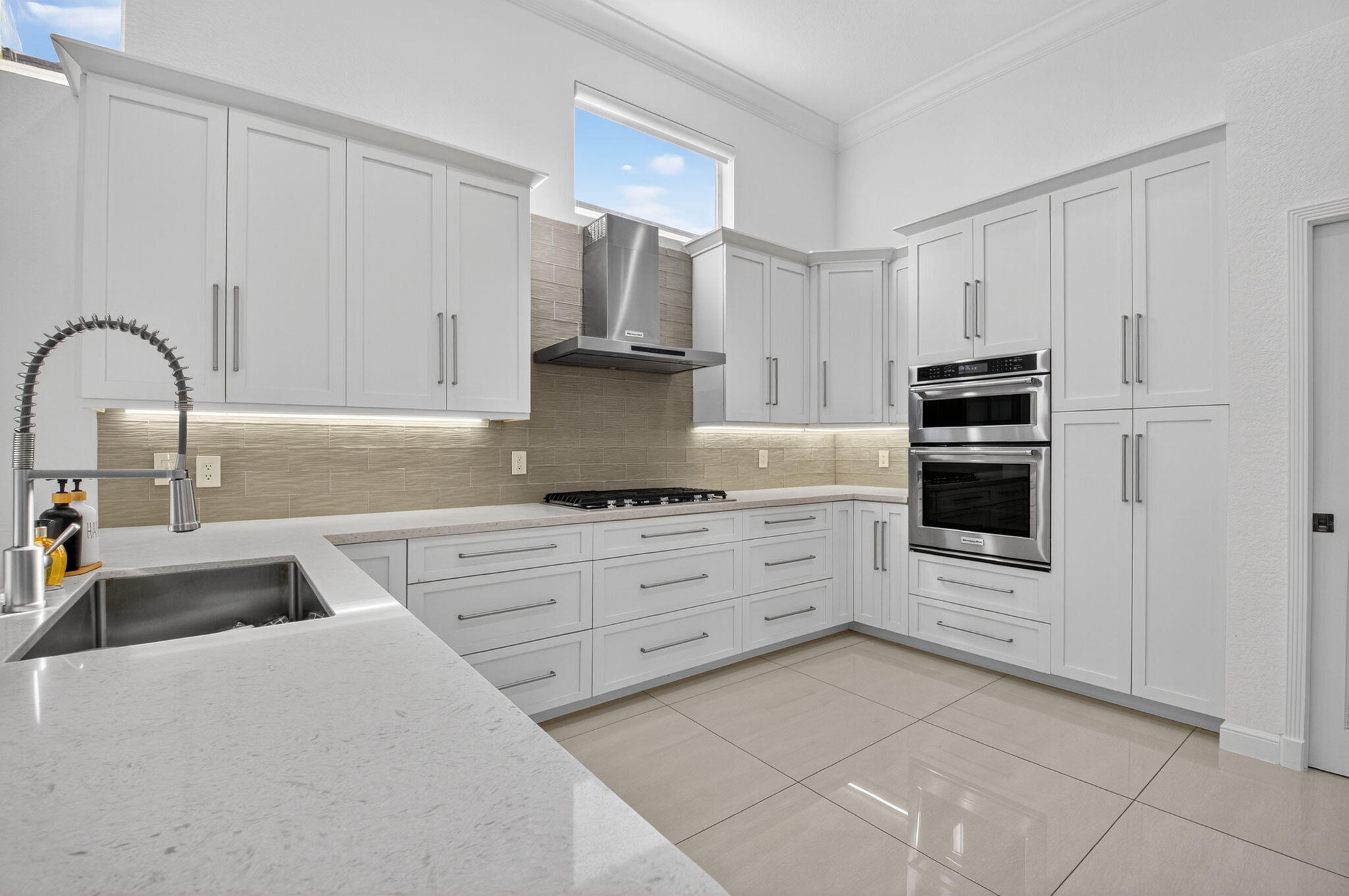6270 Northwest 43rd Terrace Boca Raton, FL 33496 - Photo 12 of 27 a kitchen with cabinets appliances and a sink