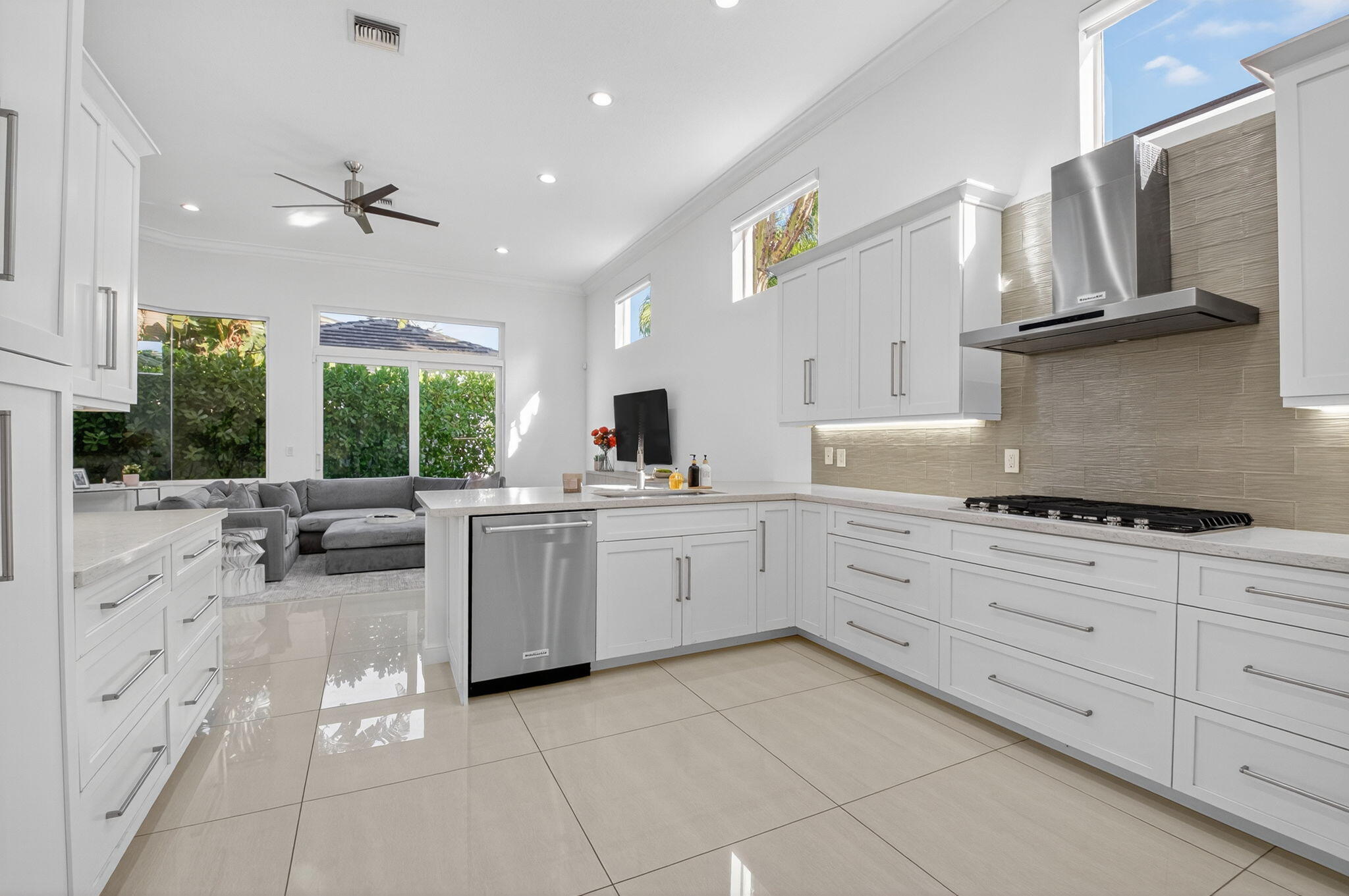 6270 Northwest 43rd Terrace Boca Raton, FL 33496 - Photo 14 of 27 a kitchen with white cabinets and appliances