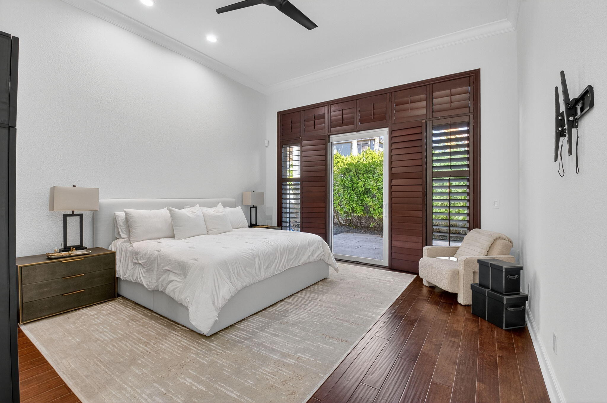 6270 Northwest 43rd Terrace Boca Raton, FL 33496 - Photo 16 of 27 a bedroom with a bed and wooden floor