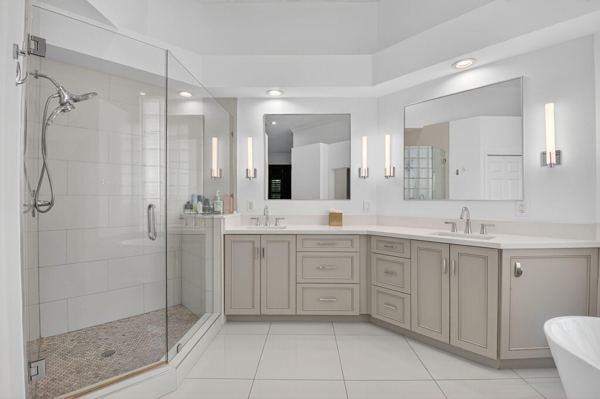 6270 Northwest 43rd Terrace Boca Raton, FL 33496 - Photo 19 of 27 a spacious bathroom with a shower sink mirror and