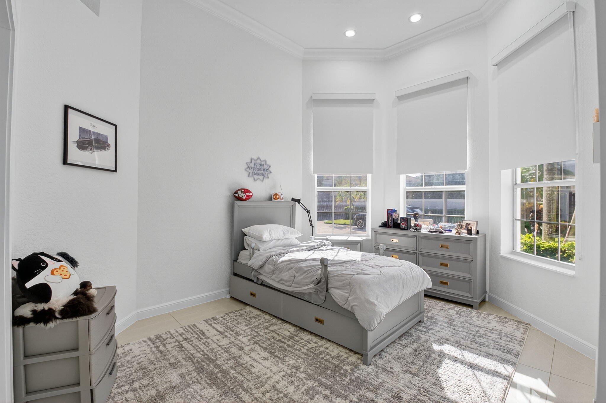 6270 Northwest 43rd Terrace Boca Raton, FL 33496 - Photo 20 of 27 a bedroom with a bed and a window