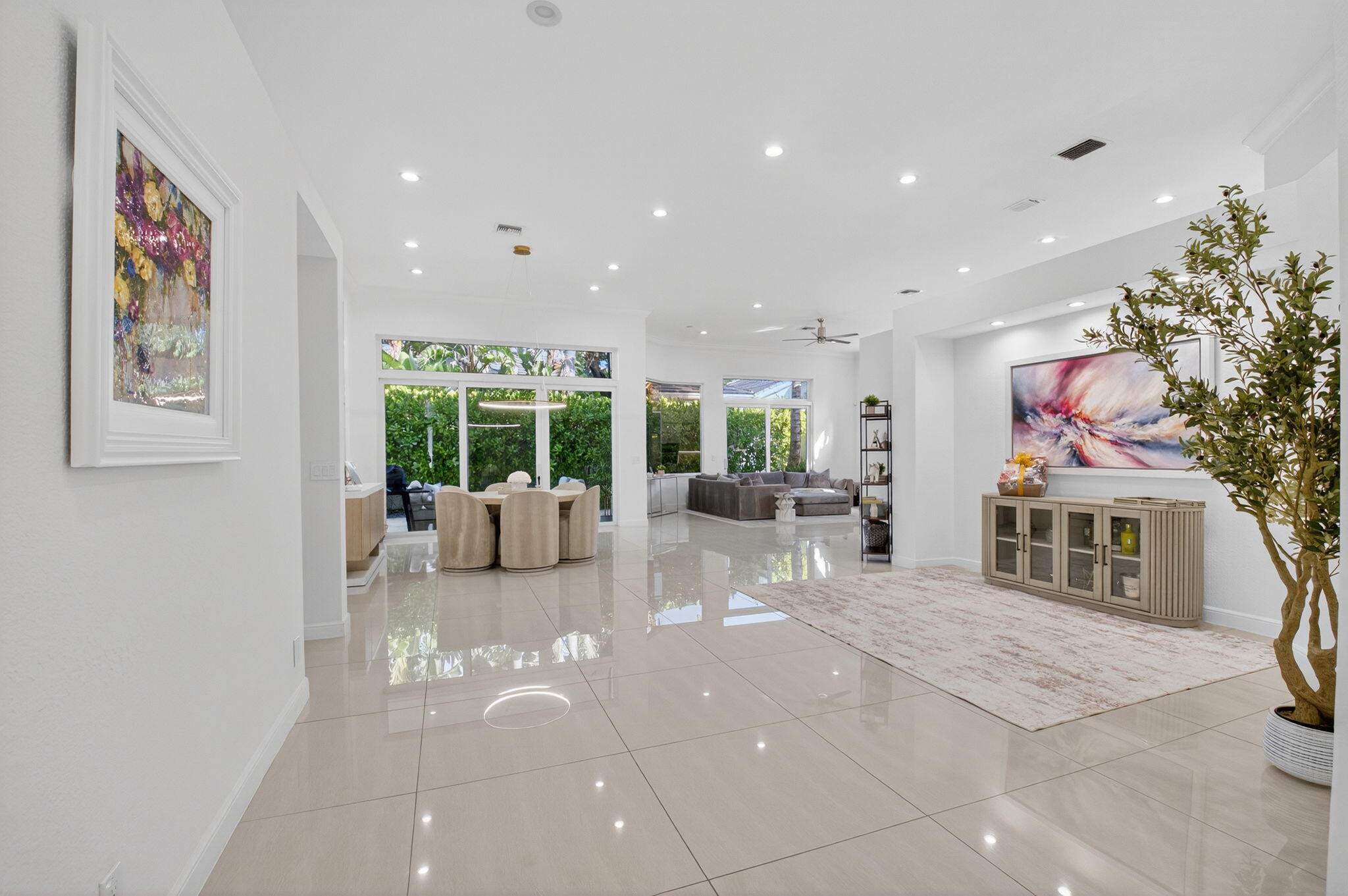 6270 Northwest 43rd Terrace Boca Raton, FL 33496 - Photo 4 of 27 a living room with furniture a large window and a potted plant