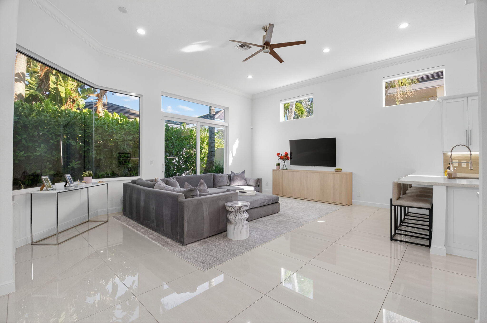 6270 Northwest 43rd Terrace Boca Raton, FL 33496 - Photo 7 of 27 a living room with furniture and large windows