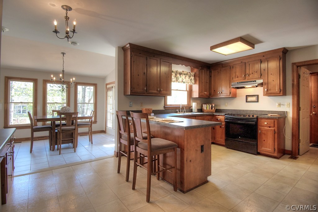 4602 Twin Cedars Road Chester, VA 23831 - Photo 13 of 47 a large kitchen with stainless steel appliances granite countertop a stove and a refrigerator