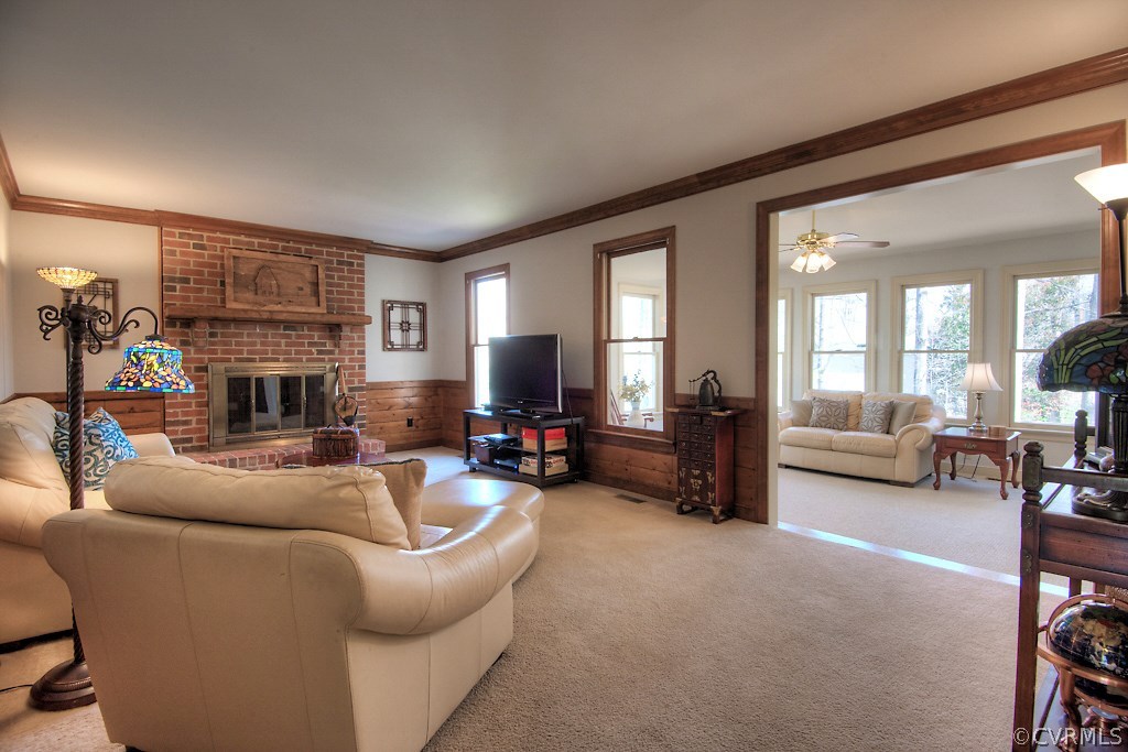 4602 Twin Cedars Road Chester, VA 23831 - Photo 16 of 47 a living room with furniture and a fireplace