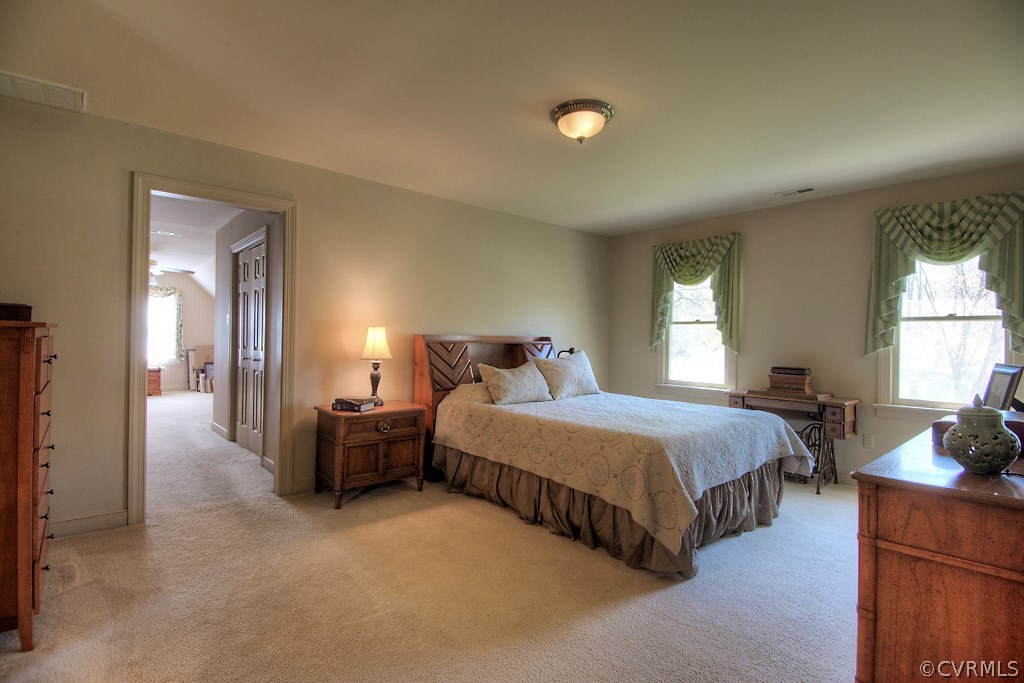 4602 Twin Cedars Road Chester, VA 23831 - Photo 24 of 47 a bedroom with bed and window