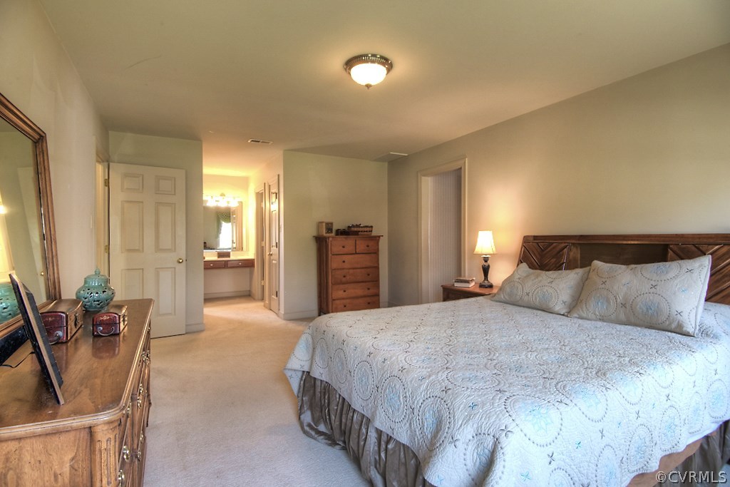 4602 Twin Cedars Road Chester, VA 23831 - Photo 25 of 47 a spacious bedroom with a bed and furniture