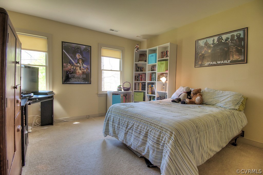 4602 Twin Cedars Road Chester, VA 23831 - Photo 31 of 47 a bedroom with double bed and a window