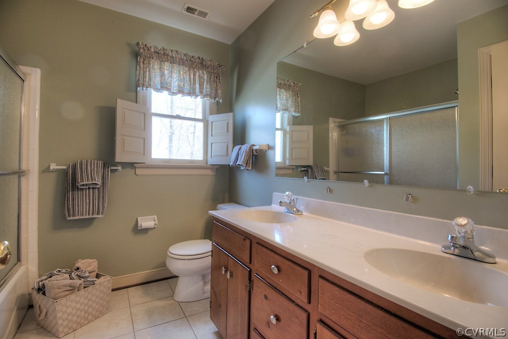 4602 Twin Cedars Road Chester, VA 23831 - Photo 34 of 47 a bathroom with a granite countertop sink a toilet and a mirror