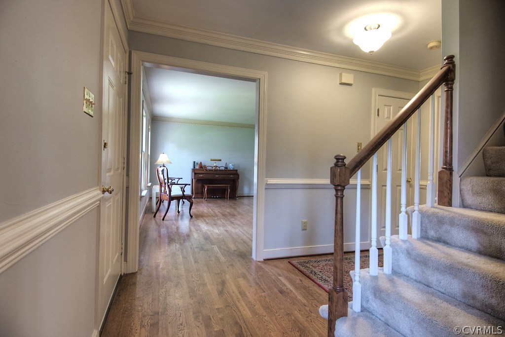 4602 Twin Cedars Road Chester, VA 23831 - Photo 4 of 47 a view of dining room with wooden floor and stairs