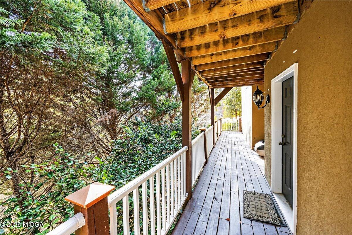 518 River Overlook Forsyth, GA 31029 - Photo 69 of 96 a view of balcony with wooden floor and fence and a porch