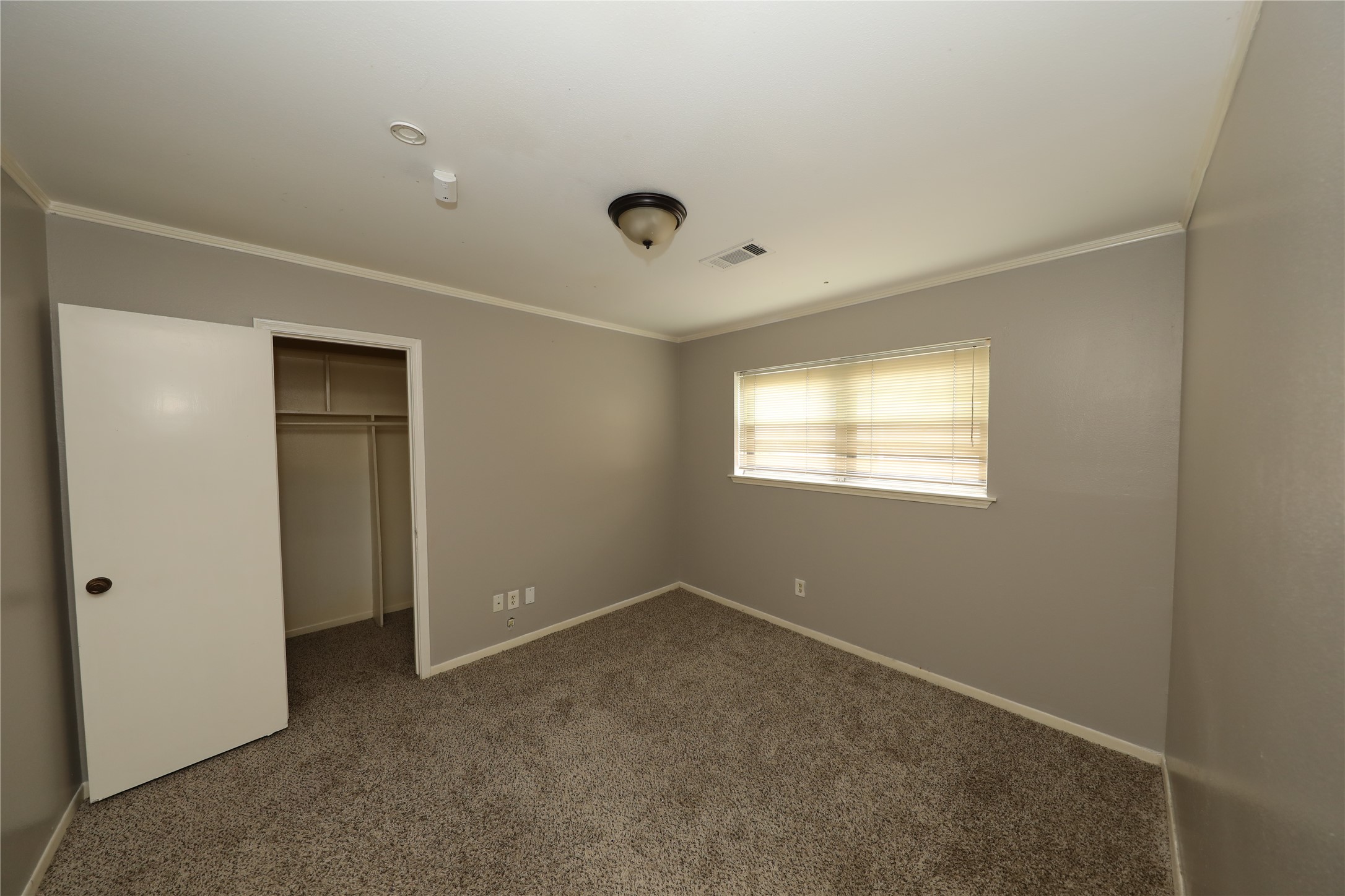 8519 Leader Street Houston, TX 77036 - Photo 14 of 27 a view of an empty room with a window