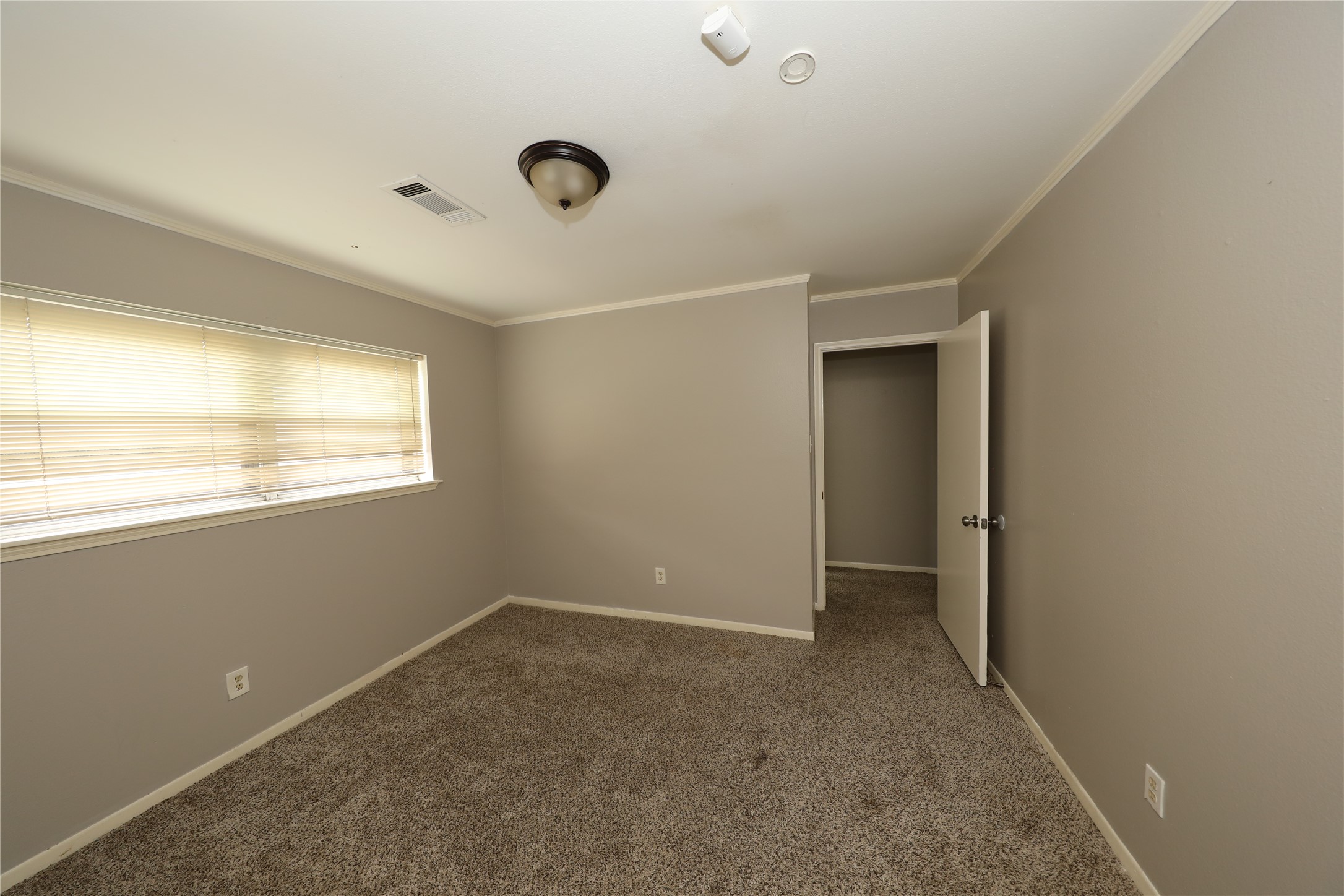 8519 Leader Street Houston, TX 77036 - Photo 15 of 27 a view of an empty room with a window