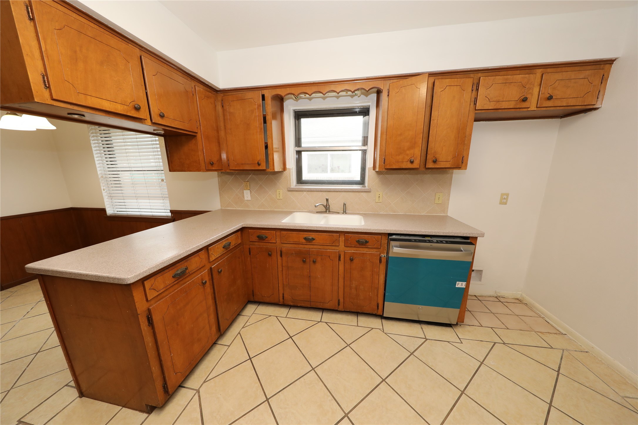 8519 Leader Street Houston, TX 77036 - Photo 17 of 27 a kitchen with stainless steel appliances granite countertop a sink stove and cabinets