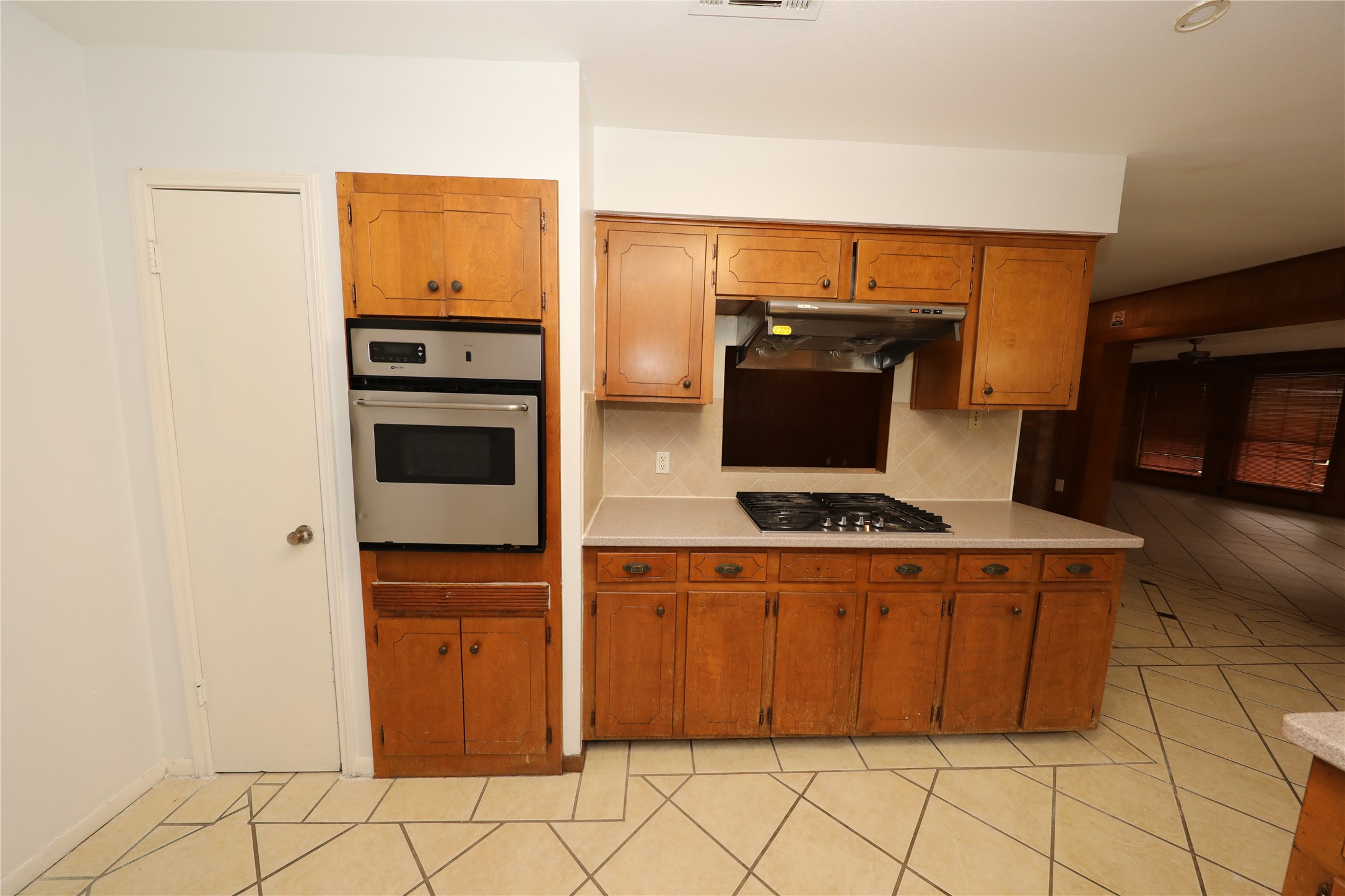 8519 Leader Street Houston, TX 77036 - Photo 18 of 27 a kitchen with stainless steel appliances a stove and a microwave