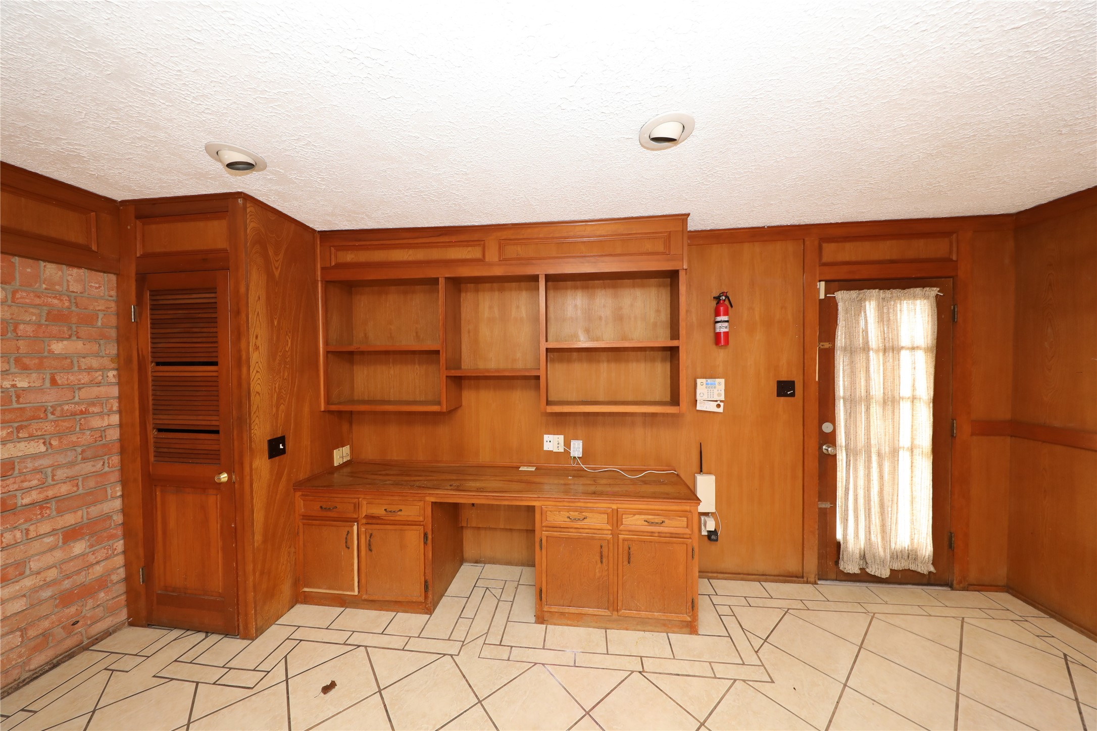 8519 Leader Street Houston, TX 77036 - Photo 21 of 27 a view of a room with shelves