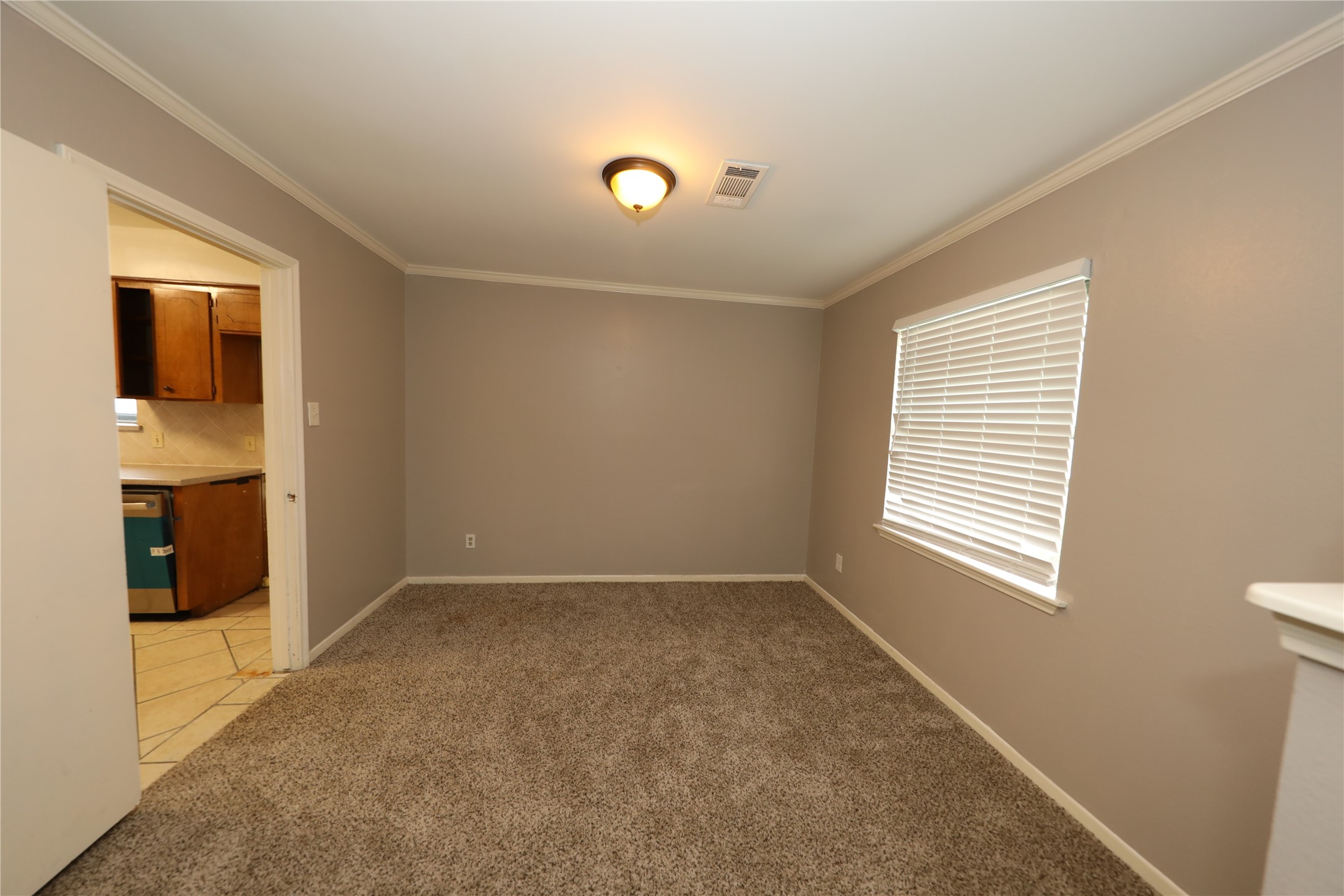 8519 Leader Street Houston, TX 77036 - Photo 4 of 27 a view of an empty room with window and closet