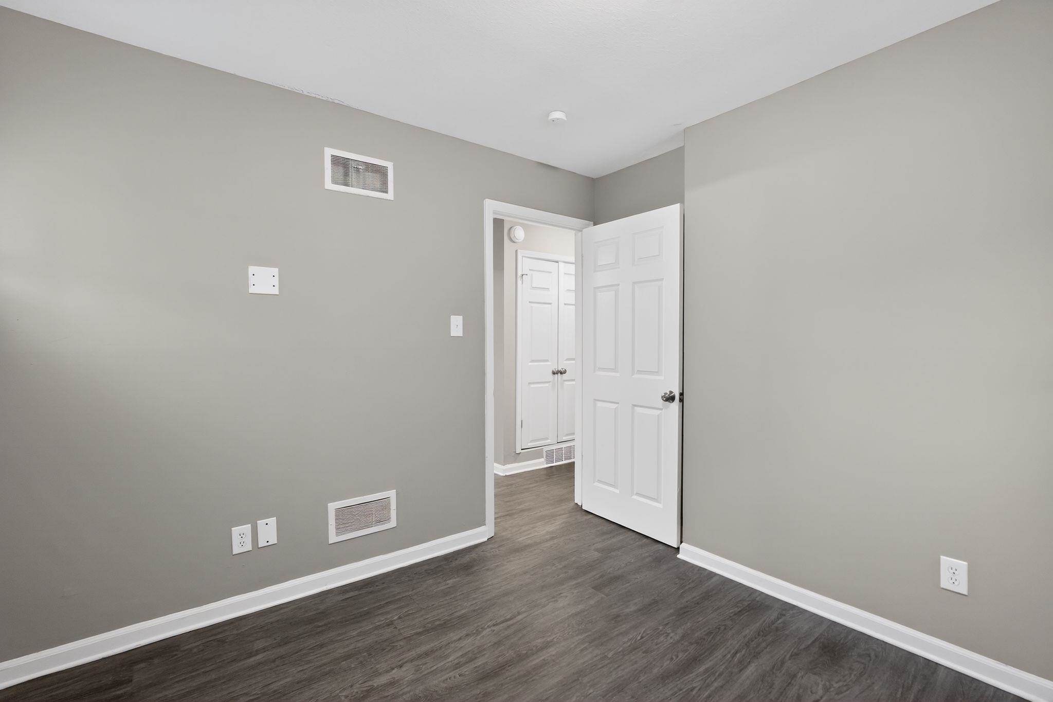 3603 England Street Memphis, TN 38127 - Photo 20 of 36 Unfurnished room featuring baseboards and dark wood finished floors