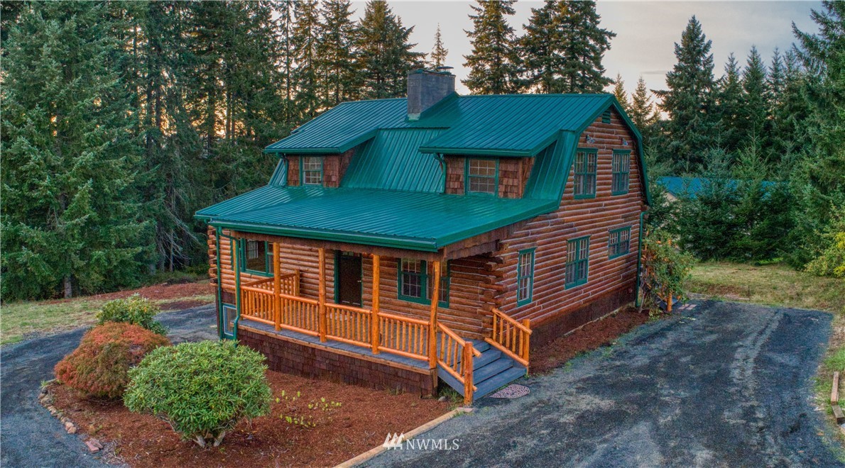 183 # 12 Spooner Road Chehalis, WA 98532 - Photo 1 of 21 a backyard of a house with a garden and deck