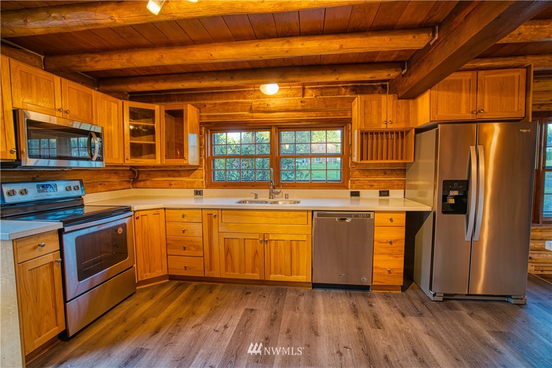 183 # 12 Spooner Road Chehalis, WA 98532 - Photo 2 of 21 a kitchen with stainless steel appliances a stove a sink and a refrigerator