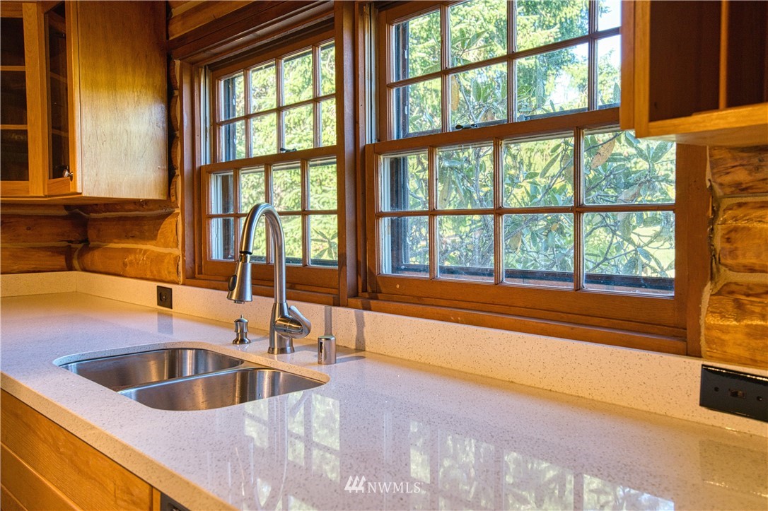 183 # 12 Spooner Road Chehalis, WA 98532 - Photo 4 of 21 a view of a kitchen with a sink and large window