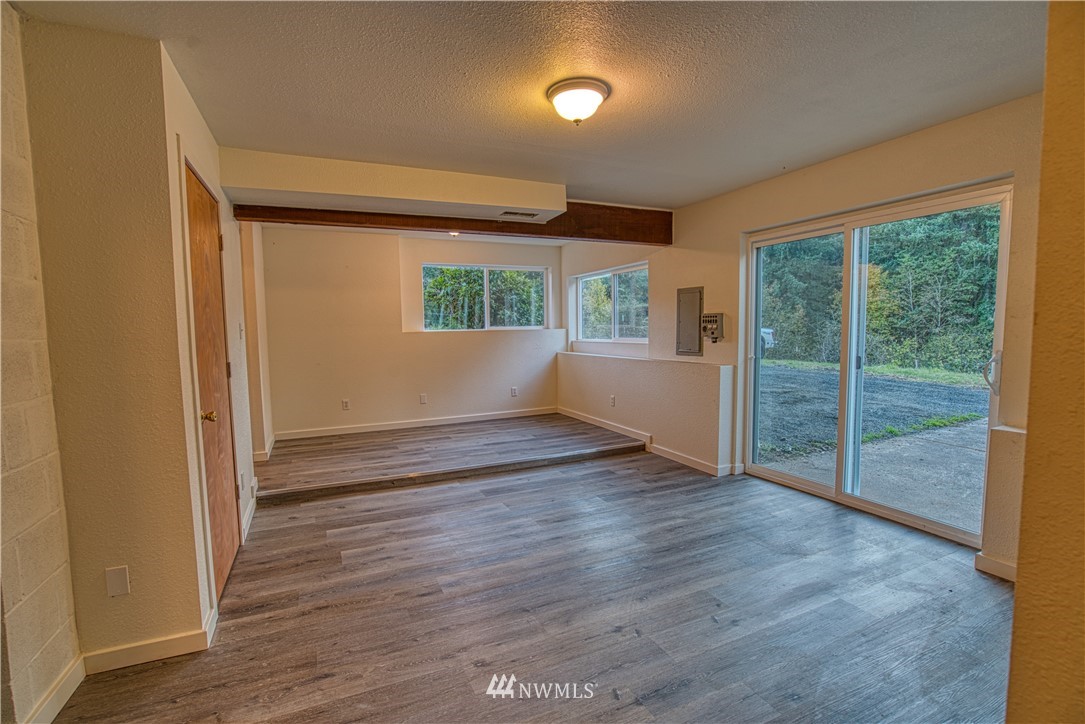 183 # 12 Spooner Road Chehalis, WA 98532 - Photo 10 of 21 an empty room with wooden floor and windows