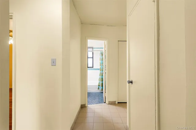 view of a bathroom with a shower and a sink