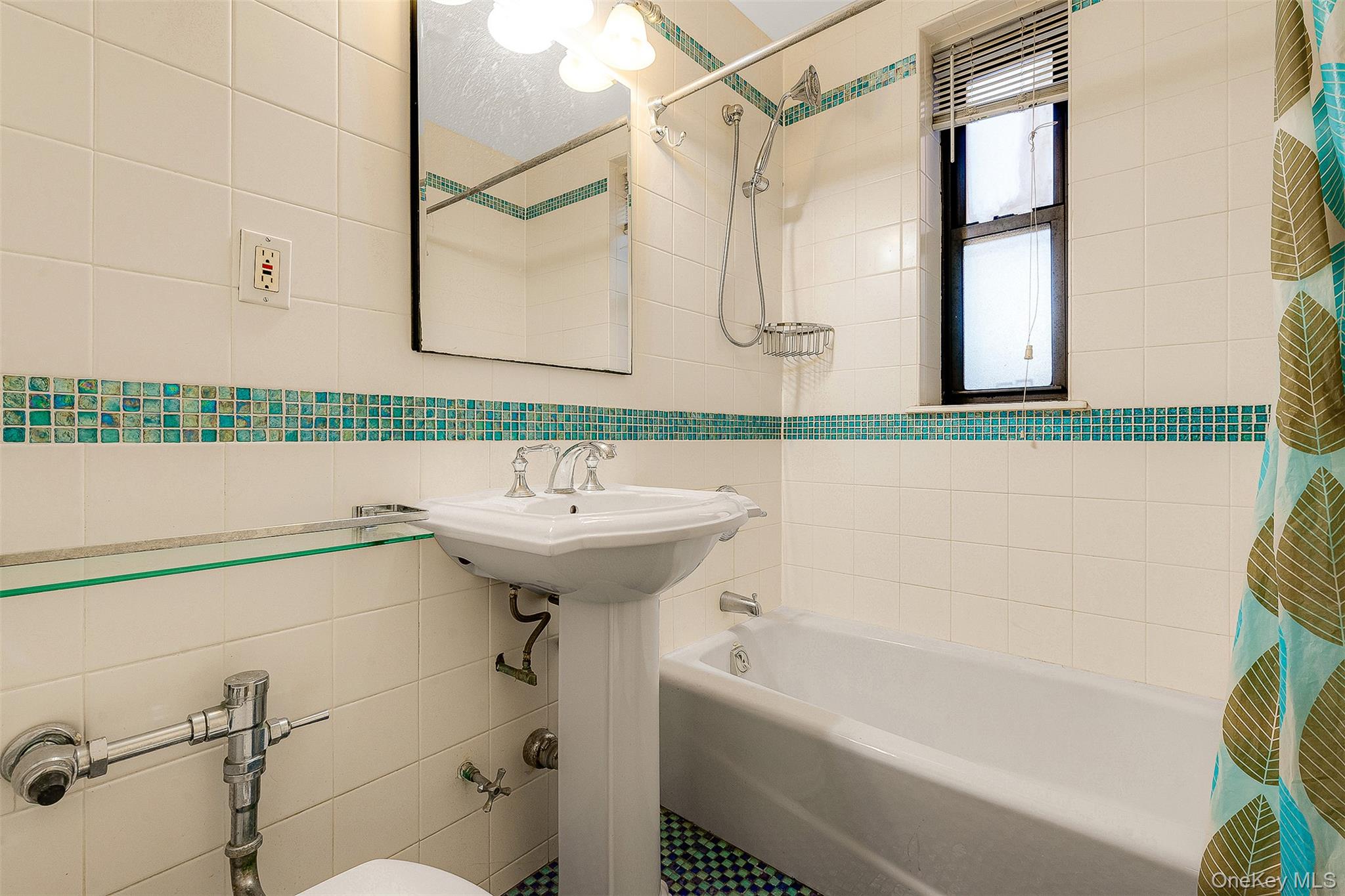 109-23 71st Road Queens, NY 11375 - Photo 14 of 21 a bathroom with a sink a bathtub and a shower
