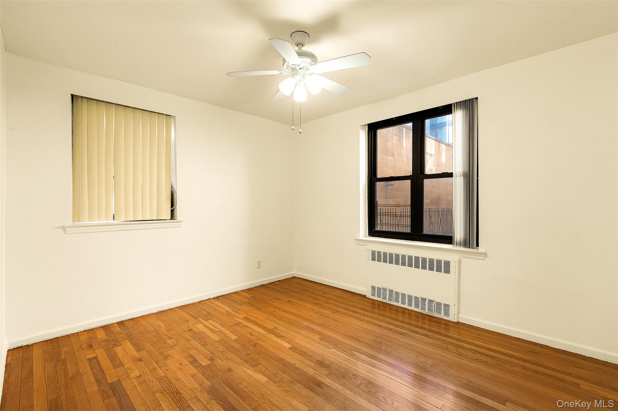 109-23 71st Road Queens, NY 11375 - Photo 15 of 21 a view of an empty room with a window
